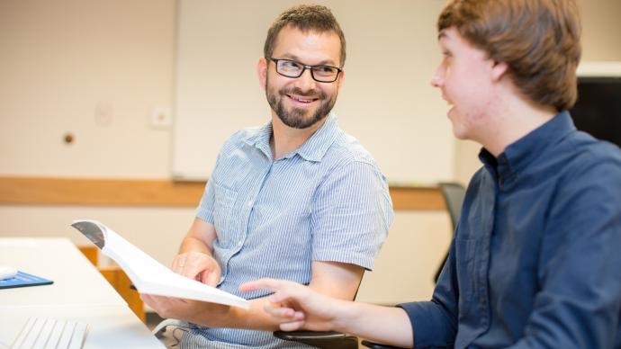 Andrew Kania and Daniel Conrad discussing philosophy books